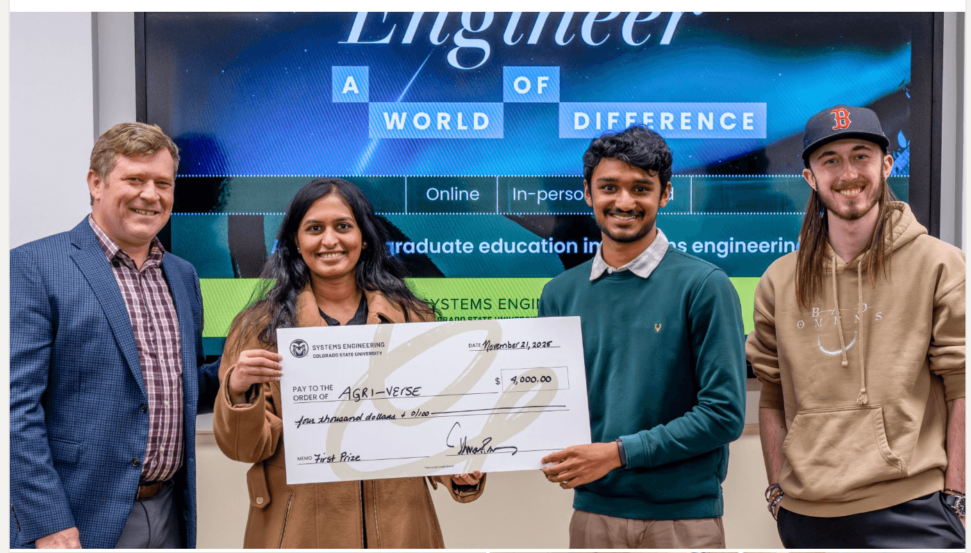 Team holding the oversized 1st-place check for AgriVerse VR.